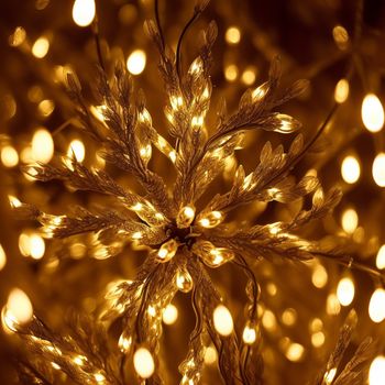 close up of a bunch of lights on a tree branch with a blurry background of lights in the background