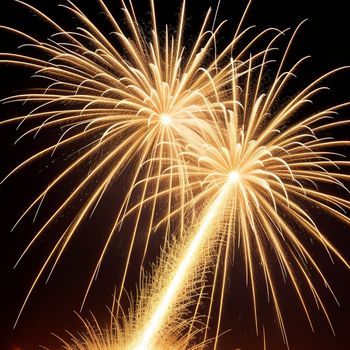 fireworks display with a black background and a red sky in the background with a few clouds in the sky