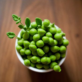 bowl of peas with a leaf on top of it on a table top with a wooden surface in the background