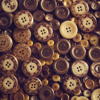 bunch of buttons that are sitting on a table together