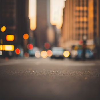 blurry picture of a city street with cars driving down it